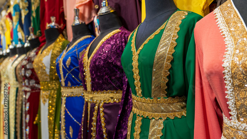 arabic women dress koftan for sale at a textile store in the souq faleh.