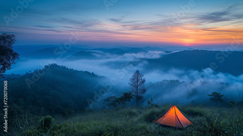 Illuminated Tent at Sunrise in Misty Hills