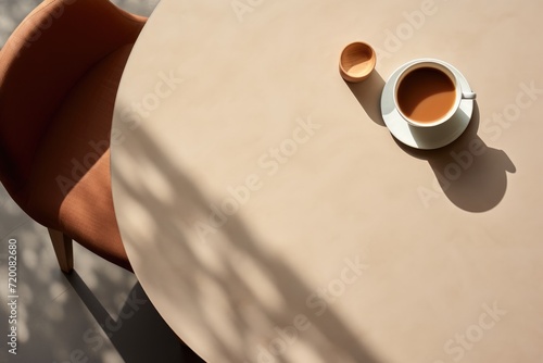 Coffee cup on coffee table top background. Overhead view.