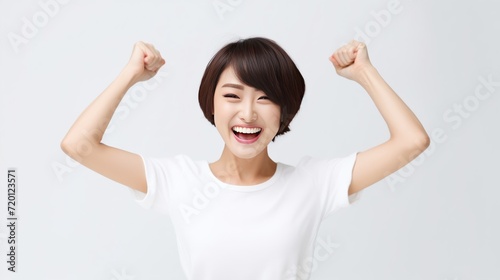 Exuberant girl raises her hand in a gesture of peak happiness, radiating a sense of relaxation and pure joy. Generative AI.