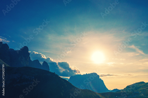 Silhouette of rocks against the sunset sky. Mountain landscape background. Rocks against the day sky. The dolomites in South Tyrol, Italy, Europe