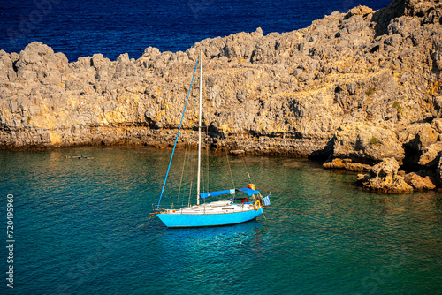 Blue yacht in St. Paul's Bay in Rhodes.