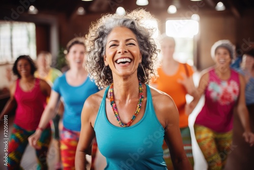Middle-aged women enjoying a joyful dance class, candidly expressing their active lifestyle through Zumba with friends. 