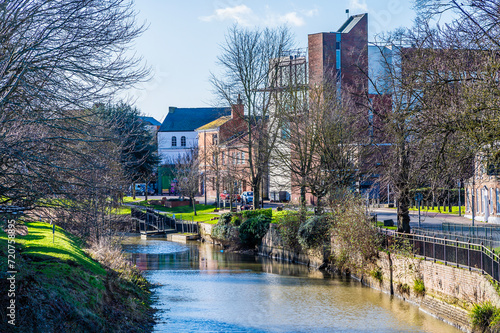 A view down the River Welland towards the centre of Spalding, Lincolnshire on a bright sunny day