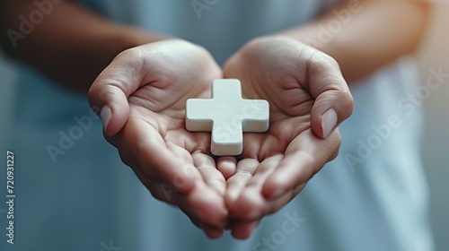 Healthcare icons and hands holding plus symbol for access, assistance, and medical welfare concept.