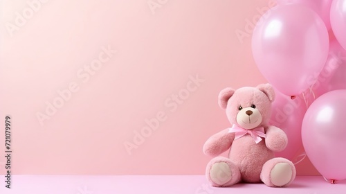 Pink balloons and a teddy bear on a pink background, a birthday and holiday concept, a birthday card for a child