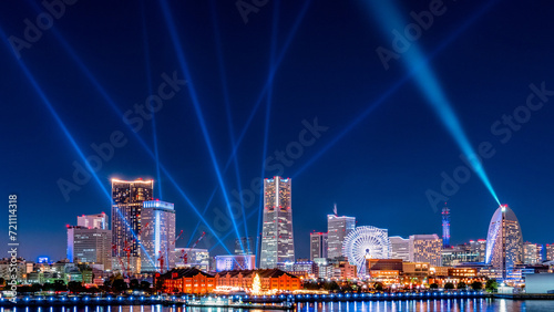 City view of Yokohama Minato-Mirai with laser show at night