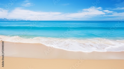A beach that is sandy and has a blue ocean.