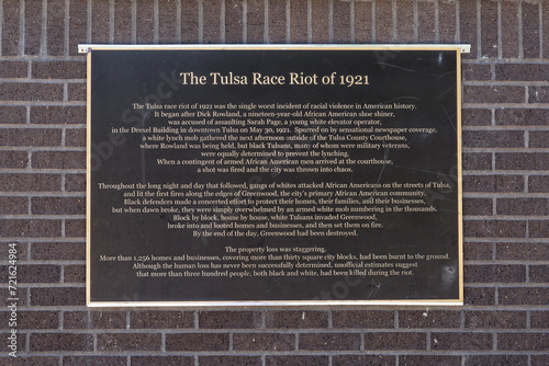 History of the Tulsa Race Riot of 1921 on a wall at the John Hope Franklin Reconciliation Park