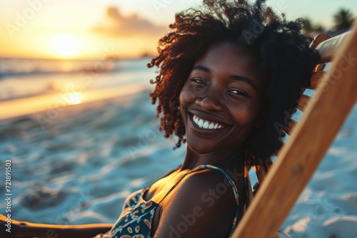 Happy African American woman sunbathing on tropical beach. Smiling girl enjoying vacation.