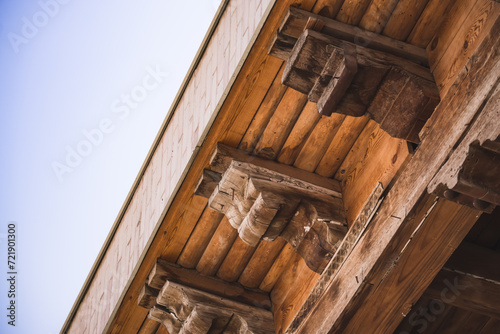 Beautifully shaped wooden beams and roofing in an ancient mosque in the ancient city of Bukhara in Uzbekistan, wooden elements of the building