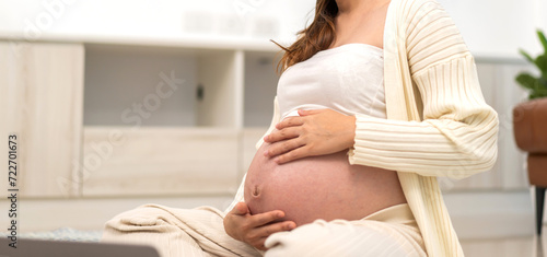 Pregnancy happy smiling Mother woman hugging and smiling expecting hold baby in belly, woman pregnant, birth, preparation, maternity, care with childbirth at home.Love of family