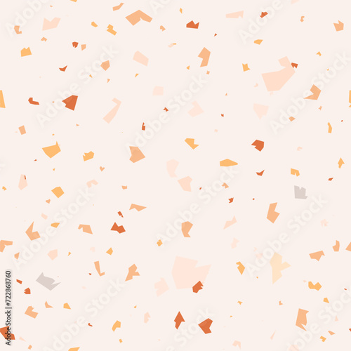Seamless terrazzo pattern in pastel yellow, beige, terracotta and ochre on ivory background. Vector marble texture with stone chips for wallpapers, fabric design and flooring surface