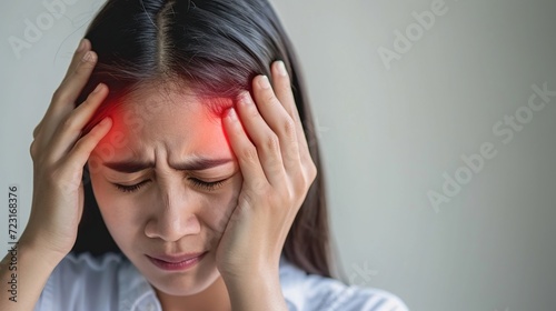 Woman hands on his head felling headache dizzy sense of spinning dizziness. Vertigo illness concept.
