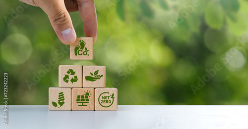 Reducing carbon emissions carbon neutral concept Net zero greenhouse gas emissions target The impact of human activities on the landscape and nature in general. Green block icon. Copy space