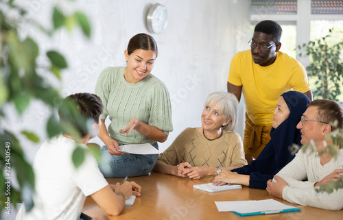 Men and women different ages discussion during business course