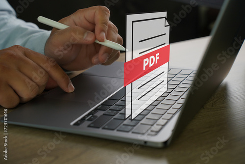 PDF button on screen Laptop computer converting process of document to another format Convert PDF files with online programs.