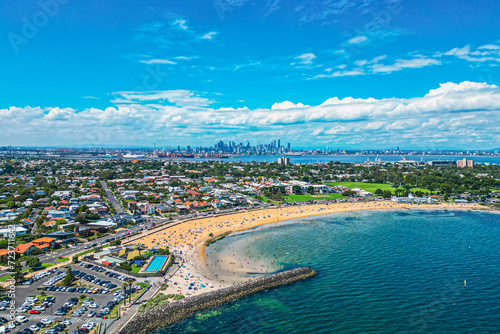 An Aerial view of Williamstown Beach with the Melbourne Skyline in the background on a Sunny Summers Day