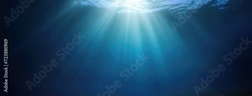 Underwater Dreamscape with Sunlight Penetrating the Depths. Tranquil and otherworldly undersea background. Panorama with copy space.