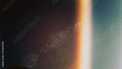 Designed film texture background with heavy grain, dust and a light leak Real Lens Flare Shot in Studio over Black Background. Easy to add as Overlay or Screen Filter over Photos overlay