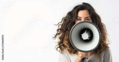 A woman holding a megaphone, promoting, discounting, protesting