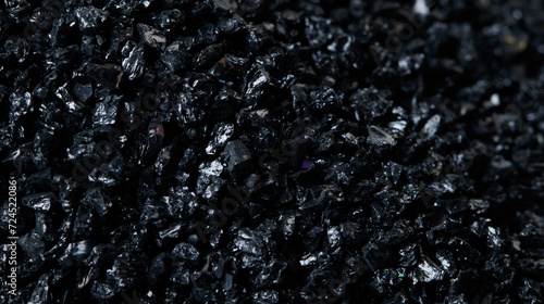 Macro close up of Silicon Carbide black sand size. Fine particle silicon carbide pile up, White background Isolated, particle element object