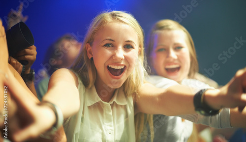 Friends, happy or selfie at concert in portrait, bonding or excited for social fun at music festival. Women, together or smile on face at live show, event or celebration in crowd at disco performance