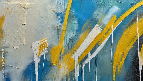 yellow and blue painted wall, Messy paint strokes and smudges on an old painted wall background. Abstract wall surface with part of graffiti. Colorful drips, flows, streaks of paint and paint sprays