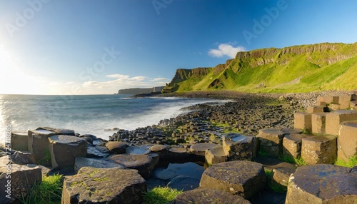 the giant s causeway at dawn on a sunny day with the famous basalt columns the result of an ancient volcanic eruption county antrim on the north coast of northern ireland uk