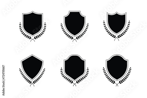 Medieval shields with laurel wreaths set. Trophy, awards, vintage insignia shields collection. Black color. Premium quality. Vector illustration isolated on white background