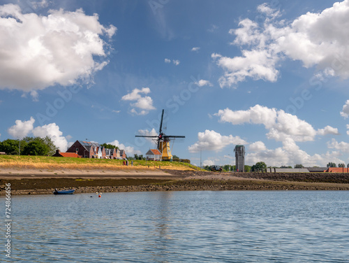 Windmill de Hoop and watertower of Sint Philipsland from Krabbenkreek, Tholen, Zeeland, Netherlands