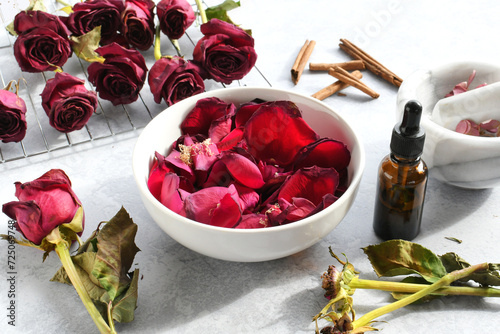 Making homemade rose potpourri by drying roses petals and adding essential oils spices, DIY