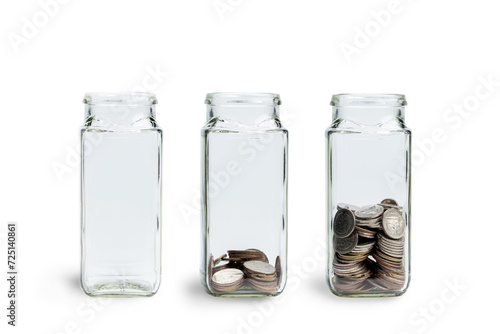 Glass jar of coins isolated on white background. jars with different level of coins. Growing savings concept with clipping path