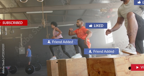 Image of social media notifications over diverse group training on boxes at gym