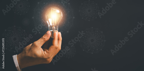 success businessman hold light bulb for good idea. brainstorming creative.Idea innovation and inspiration concept creativity with bulbs that shine, success moment and get the best idea to pass problem