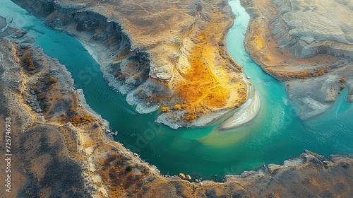 Unveiling the Curves of Nature: An Aerial Exploration of a River Cutting Through the Landscape, Showcasing Stunning Abstract Patterns