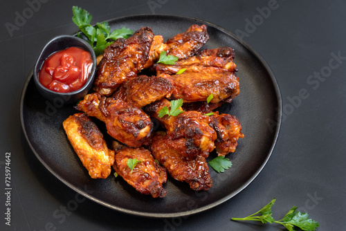Spicy chicken wings in bbq sauce , spicy chicken wings cooked in the air fryer