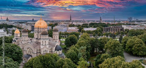 The Nativity of Christ Cathedral in Riga, Latvia. Byzantine-styled Orthodox cathedral, the largest in the Baltic region, with golden colored dome, polished gilded cupolas gleaming through the trees