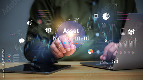 Asset management concept, Businessman Holding asset management and Icon on virtual display. Financial Property Digital assets.