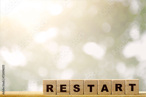 A row of wooden cubes with restart text