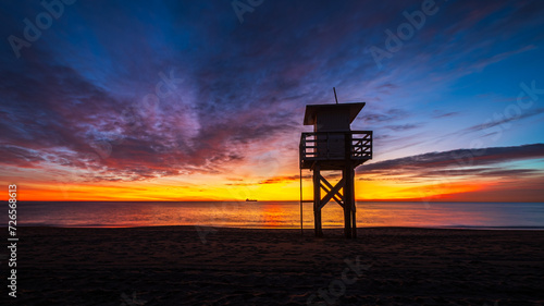 the lifeguard tower on the beach at sunrise in Vera Playa