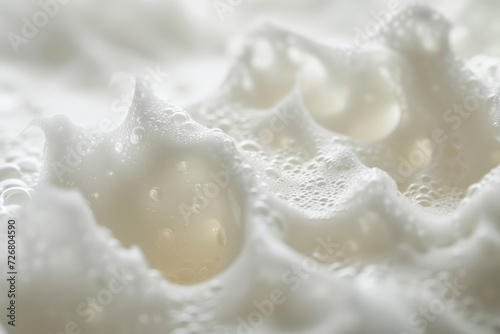 Close-up of delicate soap bubbles with a soft, dreamy white background.