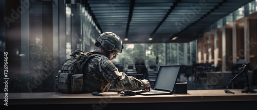 Soldier working with laptop in headquarters