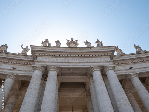 Statues of saints and apostles on colonnade of St. Peter's basilica, Vatican city, Italy. Horizontal view
