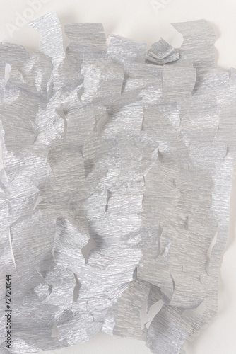 crushed and torn metallic silver crepe paper background