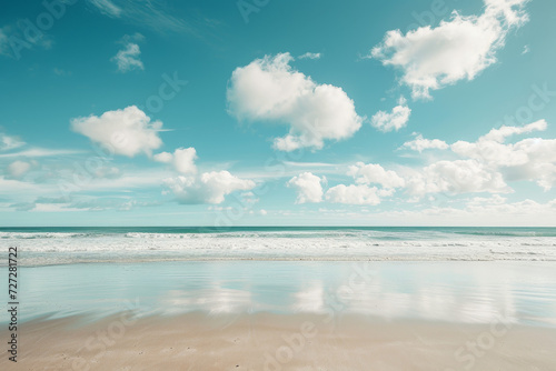 Calm Seashore with Puffy Clouds and Reflective Sand 