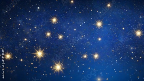 Abstract blue background with bokeh defocused lights and stars.