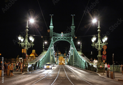 Budapest Hungary green Liberty bridge witha taxi on it at night