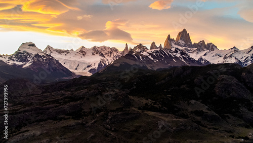 Sunset view from above of funicular clouds over Fitzroy El Chalten in Argentine Patagonia, majestic snow-capped mountains