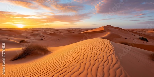 Stunning sunset over rippling sand dunes. evocative of tranquility, natural beauty, and wanderlust. perfect for travel themes and backgrounds. AI
